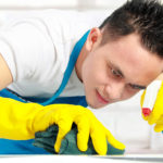 portrait of man doing some cleaning work in the house